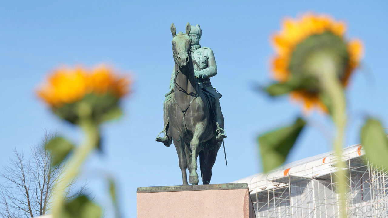 Yellow sunflowers, and the statue of Marshal Mannerheim. Helsinki, Finland