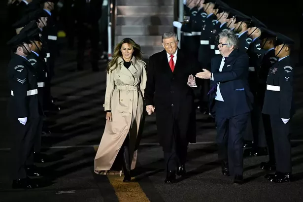 Melania held Trump's hand after they arrived in the UK