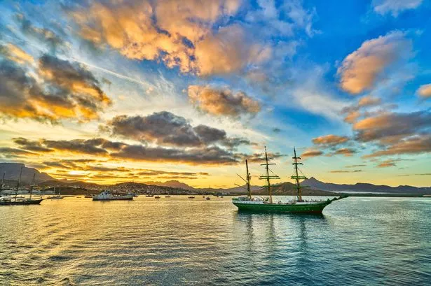 Sail ship on a bay of cabo verde in sunset