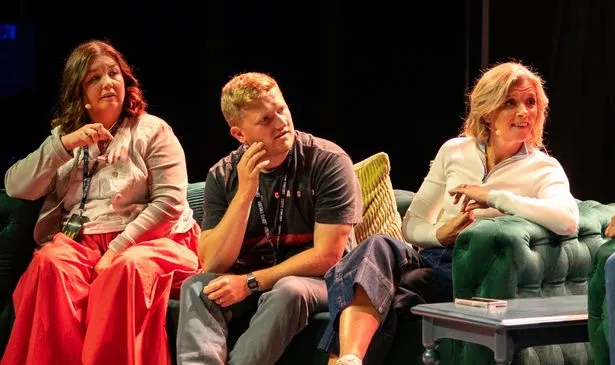 Three people on stage