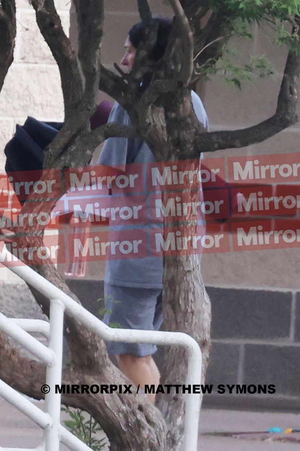 Maxwell spotted with a yoga mat and her umbrella