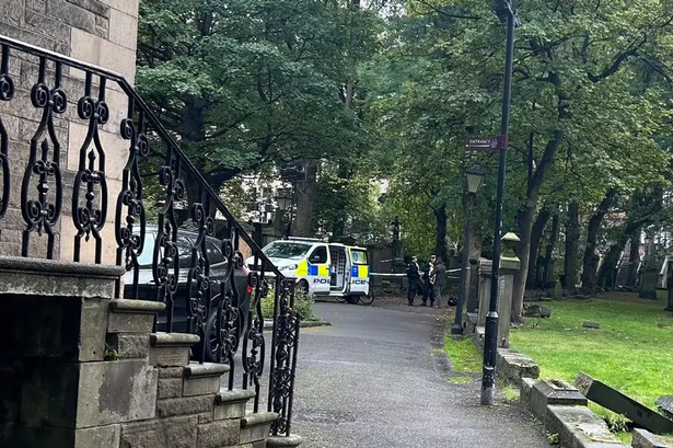 Police have taped off the graveyard near The Parish Church of St Cuthbert's.