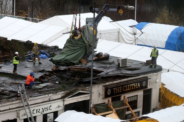 The wreckage of the police helicopter after crashing in the Clutha, Glasgow