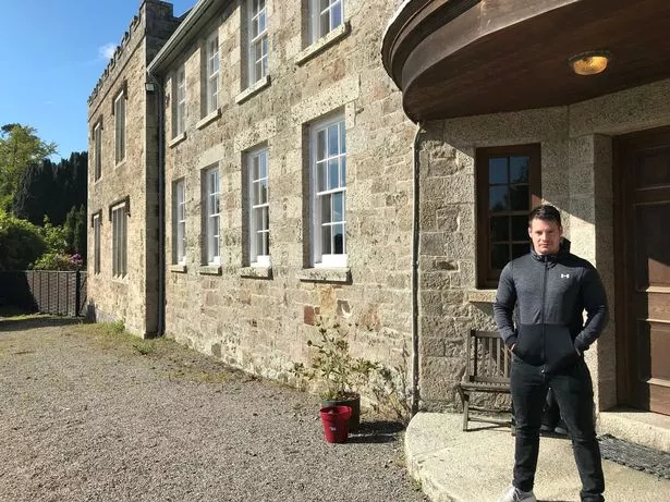 A picture of Jordan Adlard Rogers at his newly inherited stately home in 2019.
