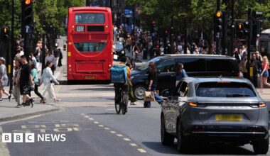 A view of Oxford Street in central London shows cars, bicycles and back of 139 bus