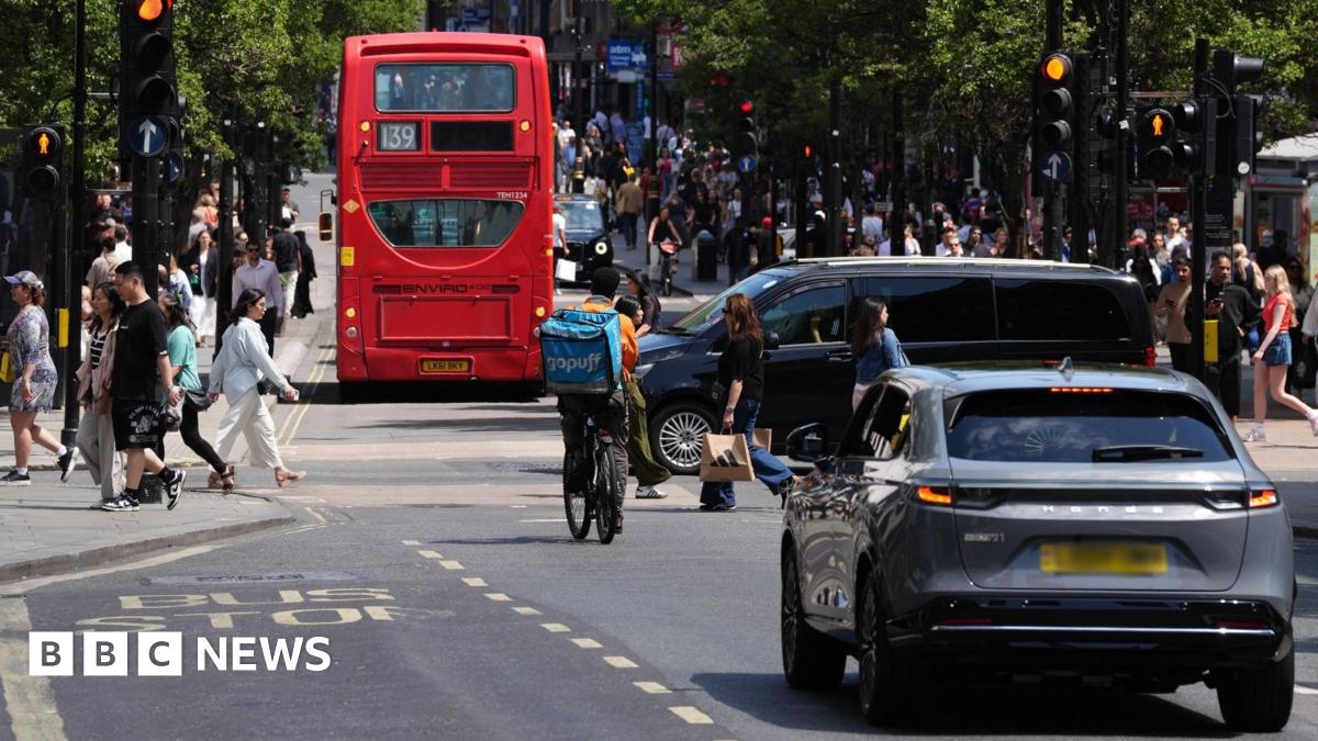 A view of Oxford Street in central London shows cars, bicycles and back of 139 bus