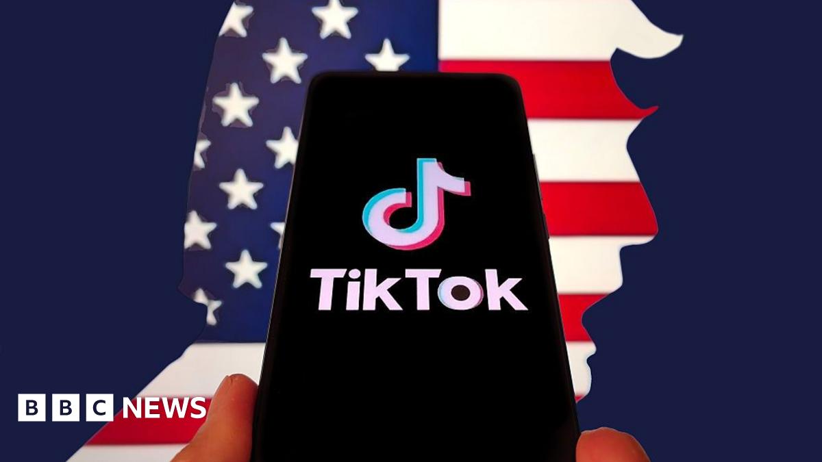 In this photo illustration, the logo of TikTok is displayed on a smartphone screen on April 5, 2025 in Shanghai, China. In the background is the American flag, cut  in the shape of Donald Trump's face.