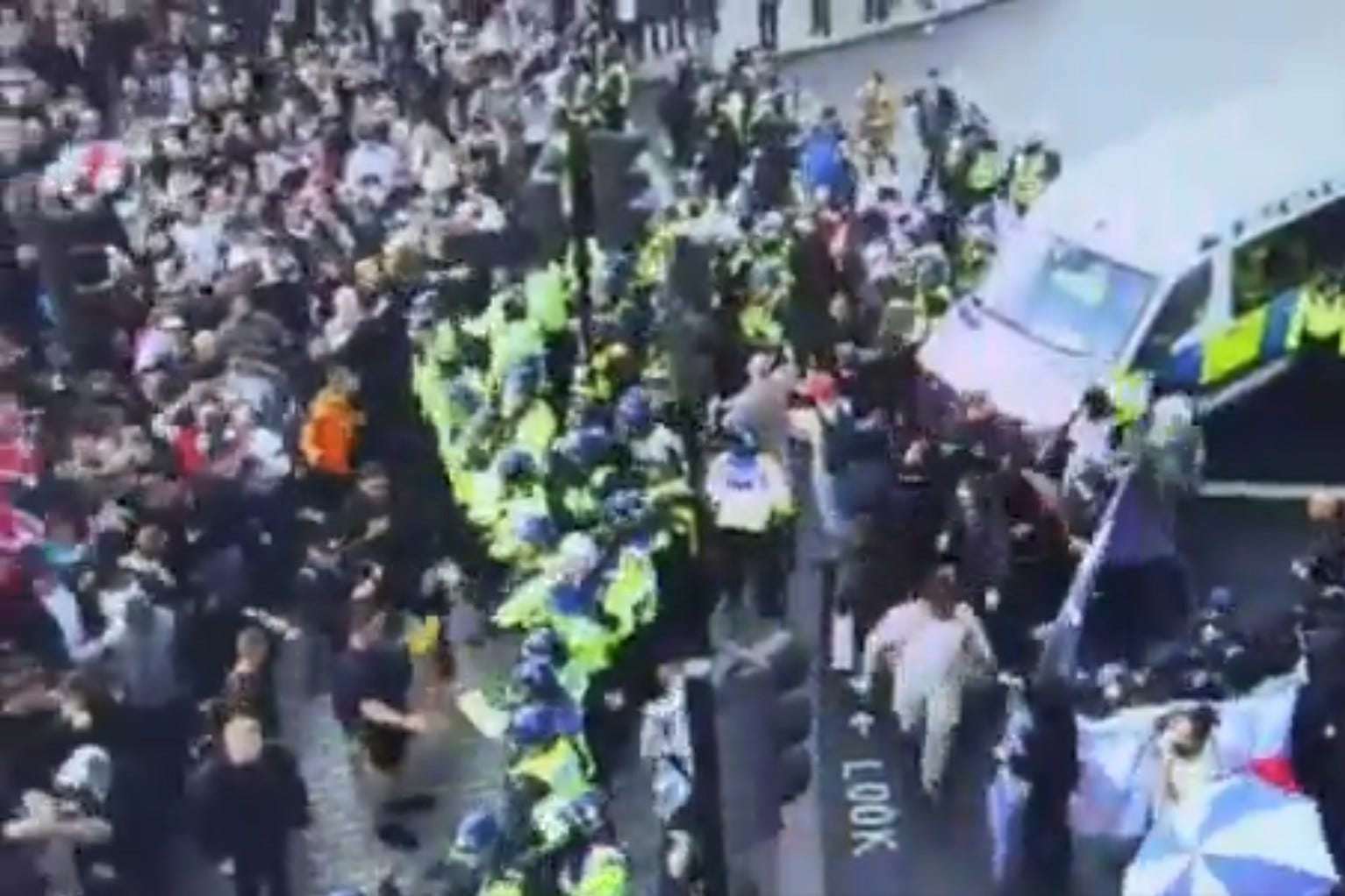 Police officers preventing a crowd of ‘Unite the Kingdom’ protesters trying to access ‘sterile’ areas during the Tommy Robinson-led Unite the Kingdom march and rally in central London (Metropolitan Police/PA)