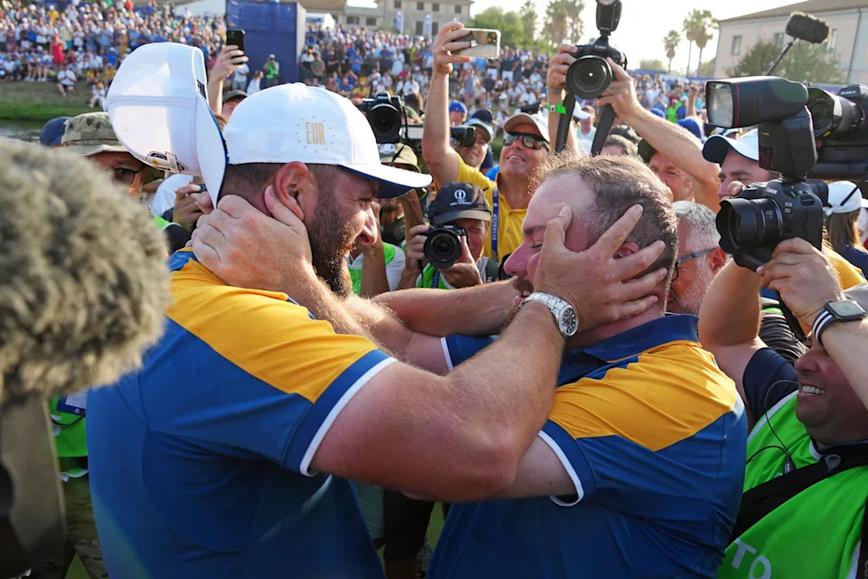 Team Europe golfers Jon Rahm and Tyrrell Hatton celebrate after beating Team USA during the final day of the 44th Ryder Cup golf competition at Marco Simone Golf and Country Club.