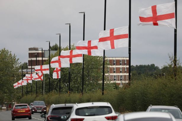England flags flying on lampposts on Genners Lane along Bartley Reservoir , Bartley Green Birmingham.
