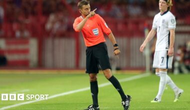 Referee Clement Turpin points to the stands during England's World Cup qualifier with Serbia in Belgrade