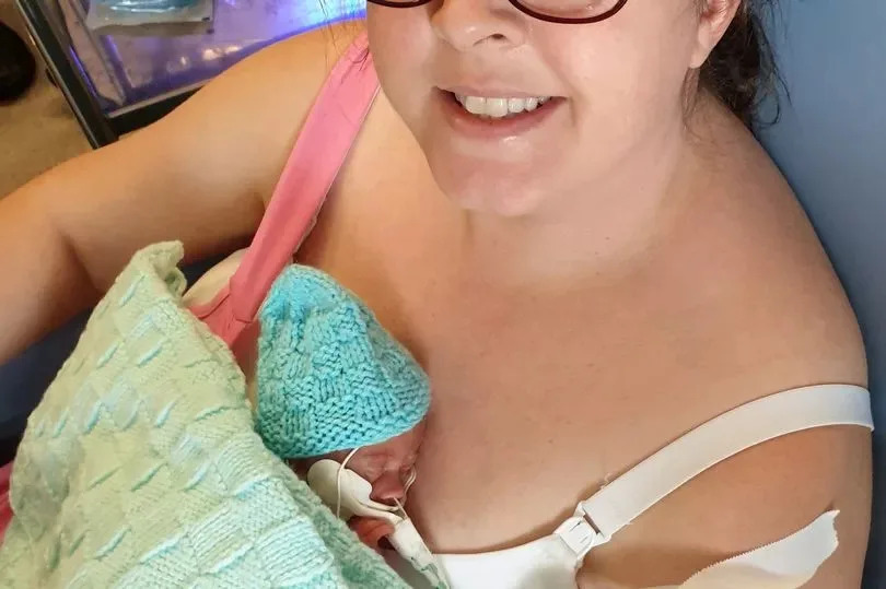 Natasha Hewitt holding her baby Harry