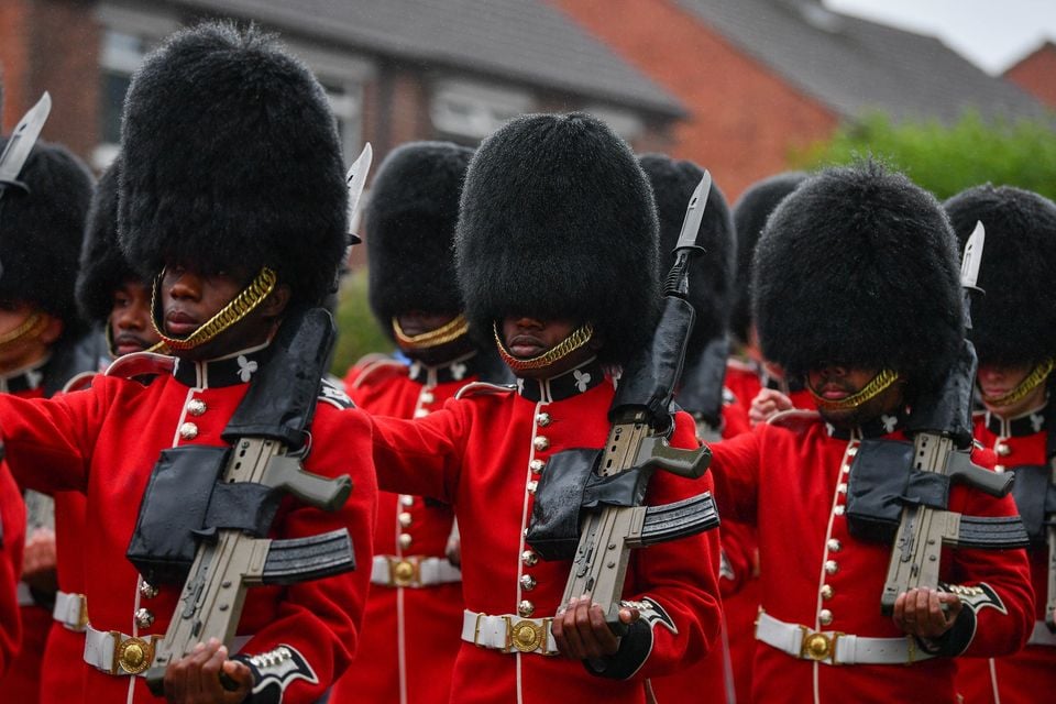 The Irish Guards today were on Parade today as they are laying down their regimental colours at St. Mark's Parish Church in Dundela, East Belfast. This event is a historic, one-off event to mark the regiment's 125th anniversary and will be the only set of their colours to reside outside of London.  The Parade which took place along Belmont Road featured the Band of the Irish Guards, Pipes and Drums Irish Guards and Campbell College Pipe Band along with the Irish Guards Association & Army Cadet force.

Photo - Andrew McCarroll/ Pacemaker Press