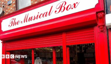 The red frontage of The Musical Box record shop in Liverpool.