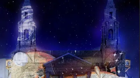 Ocubo A light display projected to the walls of Leeds Civic Hall. The night sky is filled with stars. 