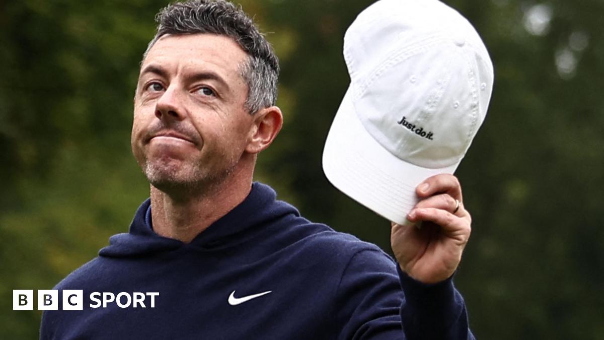 Rory McIlroy waves his cap to the crowd after finishing with an eagle three on the par-five 18th at Wentworth on Sunday