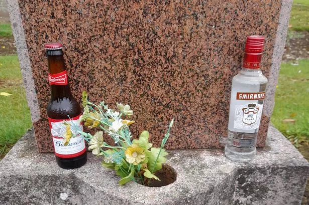 Alcohol next to a grave. 