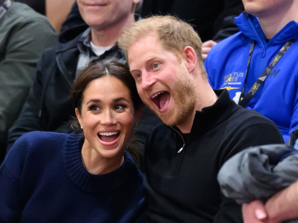Meghan Markle and Prince Harry with their mouths wide open