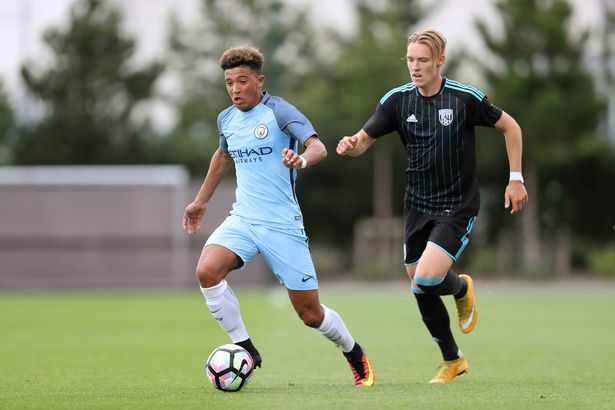 Jadon Sancho runs with the ball