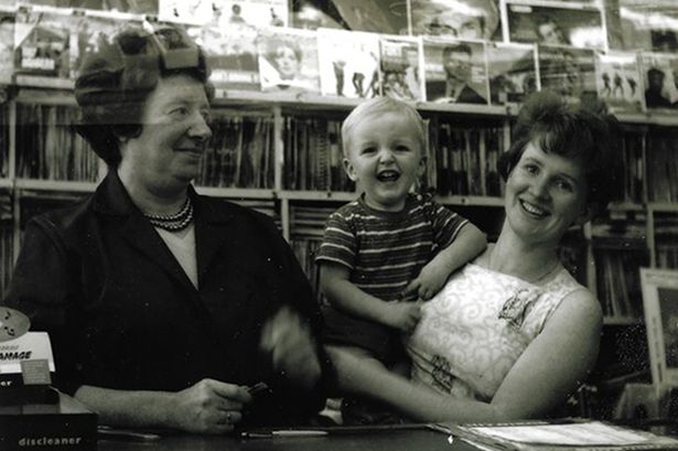 The Musical Box Record Shop on West Derby Road in Tuebrook is about to reach a milestone birthday. Thought to be the oldest surviving record store in Liverpool, it's run by owners Tony Quinn and his wife Paula. Pictured, Tony Quinn's nan Diane Cain (shop's original owner) next to two-year-old Tony in the arms of his mum, Diane.