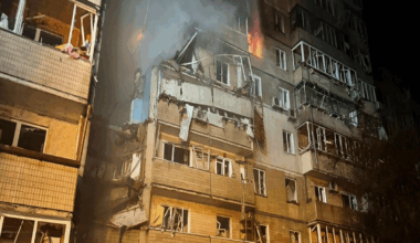 A firefighter looks at a partially destroyed residential house in Kyiv, following a Russian drone attack. Photo: 7 September 2025