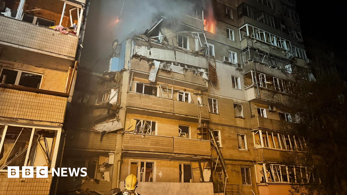 A firefighter looks at a partially destroyed residential house in Kyiv, following a Russian drone attack. Photo: 7 September 2025