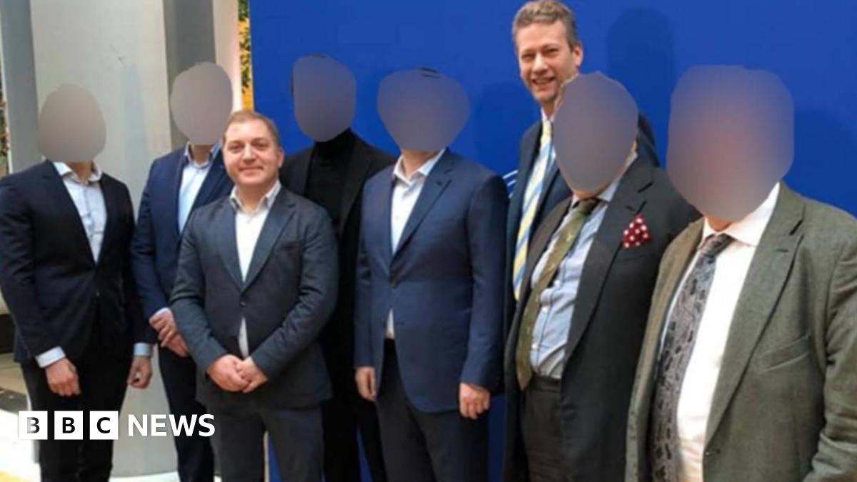 Published on the website of a Ukrainian tv channel (112ua.tv) in February 2019 - the channel has been shut down by Zelensky after the Russian invasion. Third from left is Oleg Voloshyn, named in David Deans' copy and was the man in contact with Nathan Gill before his speeches in the European Parliament. Gill and Voloshyn both wear suits and stand among six other men in suits.