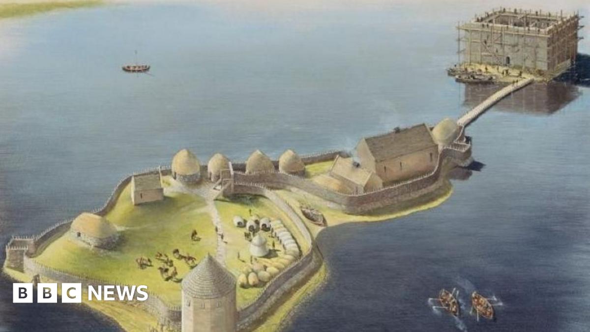 A visualisation showing the previously unknown castle at Finlaggan. It shows two small islands in a loch. The nearest one has thatched roof buildings and a conical-shaped tower. The furthest island has a stone keep and is connected to the other island by a bridge.