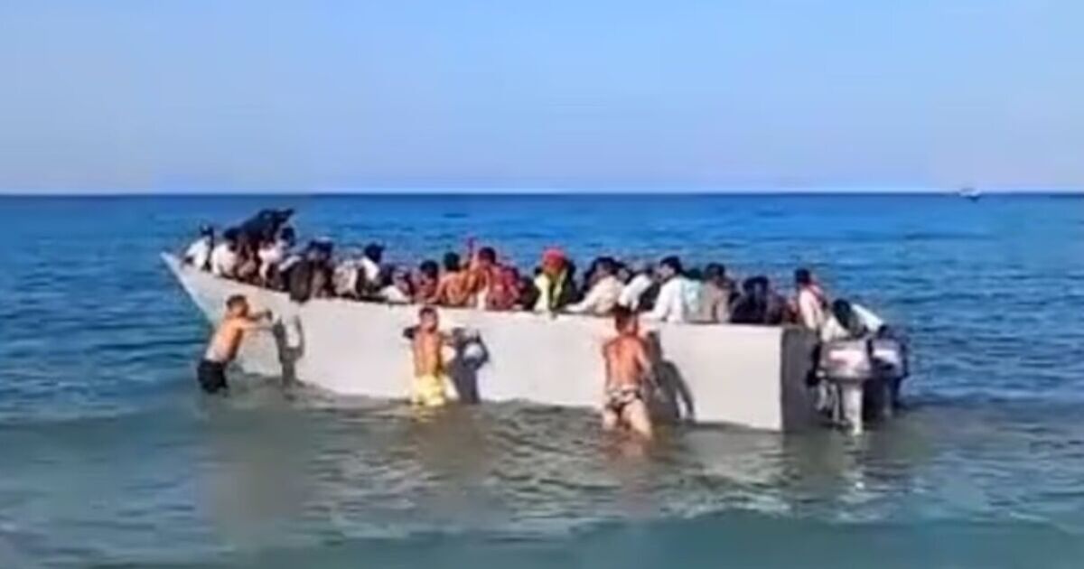 Moment raging tourists reject migrant boat and push it BACK into water | World | News
