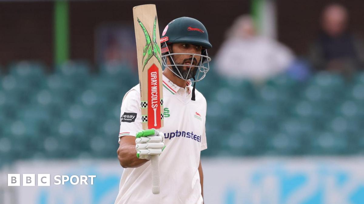 Shan Masood raises his bat after reaching 100 for Leicestershire against Gloucestershire