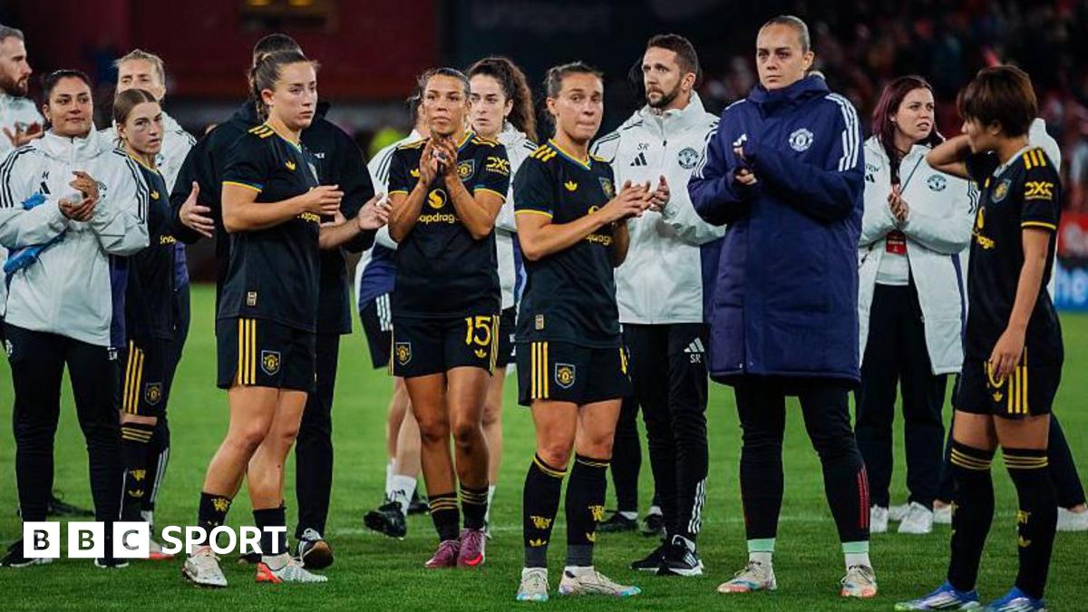 Manchester United players stand on the pitch after losing against Bergen in the Champions League