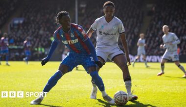 Romain Esse of Crystal Palace shields the ball under pressure from Millwall's Raees Bangura-Williams in the sunshine at Selhurst Park