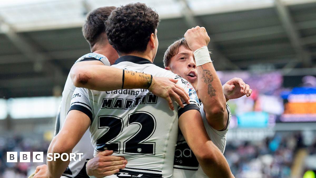 Hull FC player Lewis Martin is congratulated by teammates after scoring against Warrington Wolves.