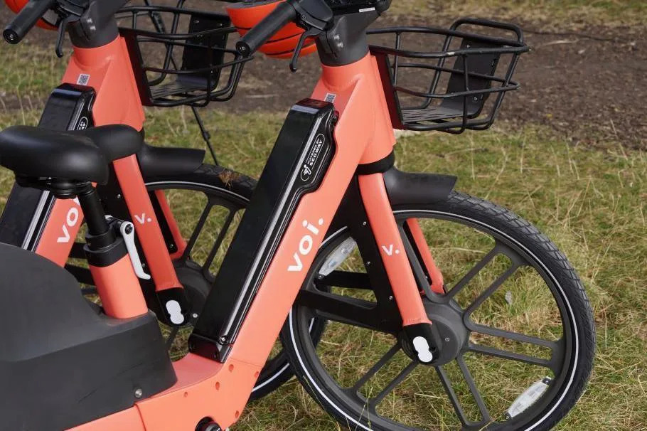 A close up of the bikes which are orange.