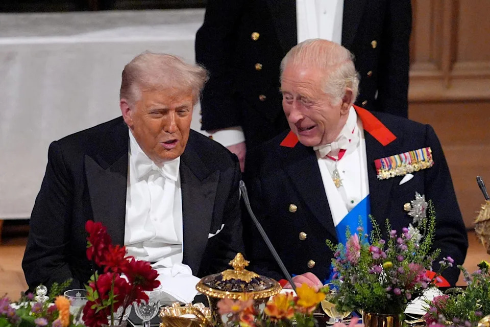 Mr Trump speaks to King Charles during a banquet at Windsor Castle for last week’s state visit (PA)