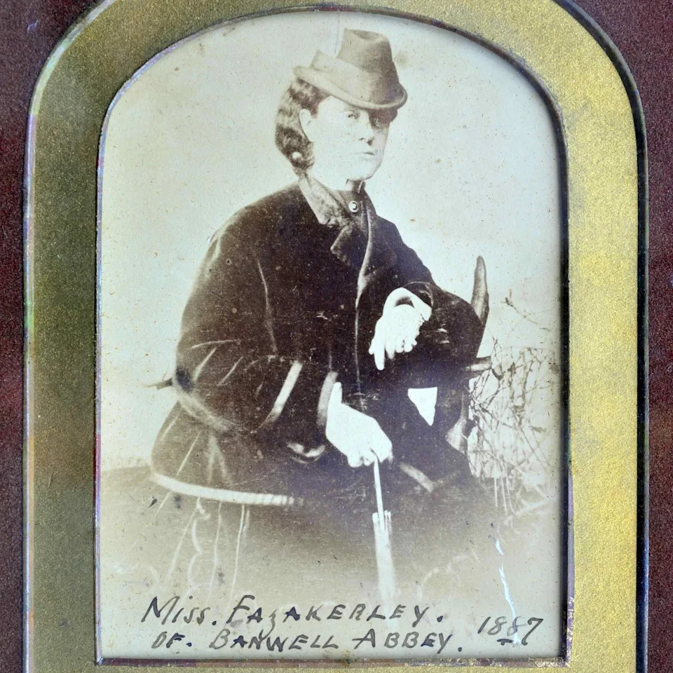 Emily posing for a photograph with parasol in hand. Finely dressed, this was taken from her time living at Banwell Abbey in Somerset where she move to in 1883, because of her failing health