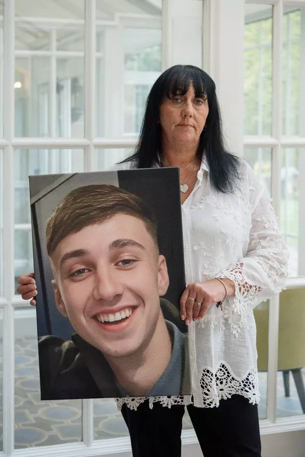 Debbie Duncan holding photo of Jay