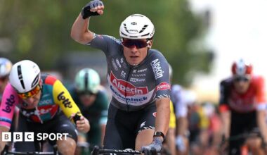 Belgium's Jasper Philipsen punches the air in celebration of his stage victory