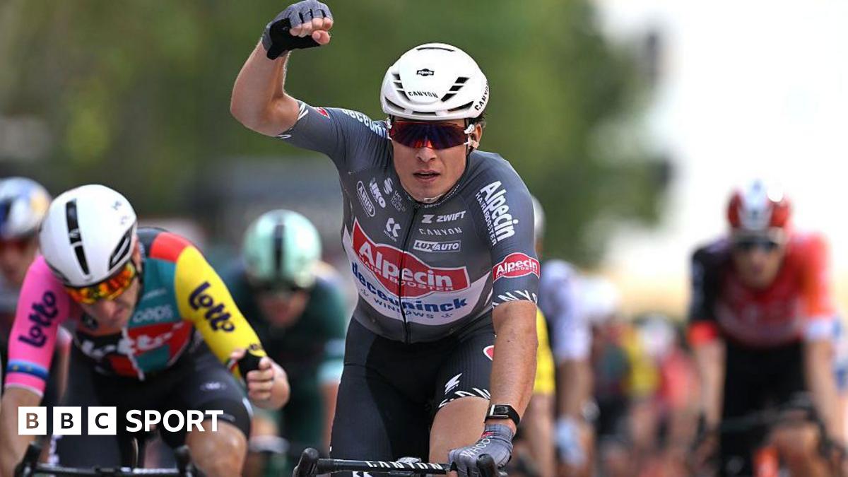 Belgium's Jasper Philipsen punches the air in celebration of his stage victory