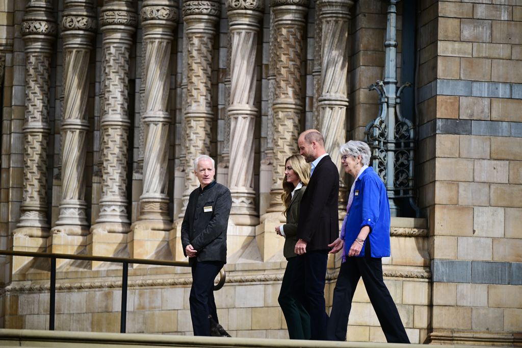 Prince William and Kate Middleton being shown around the outside of the Natural History Museum