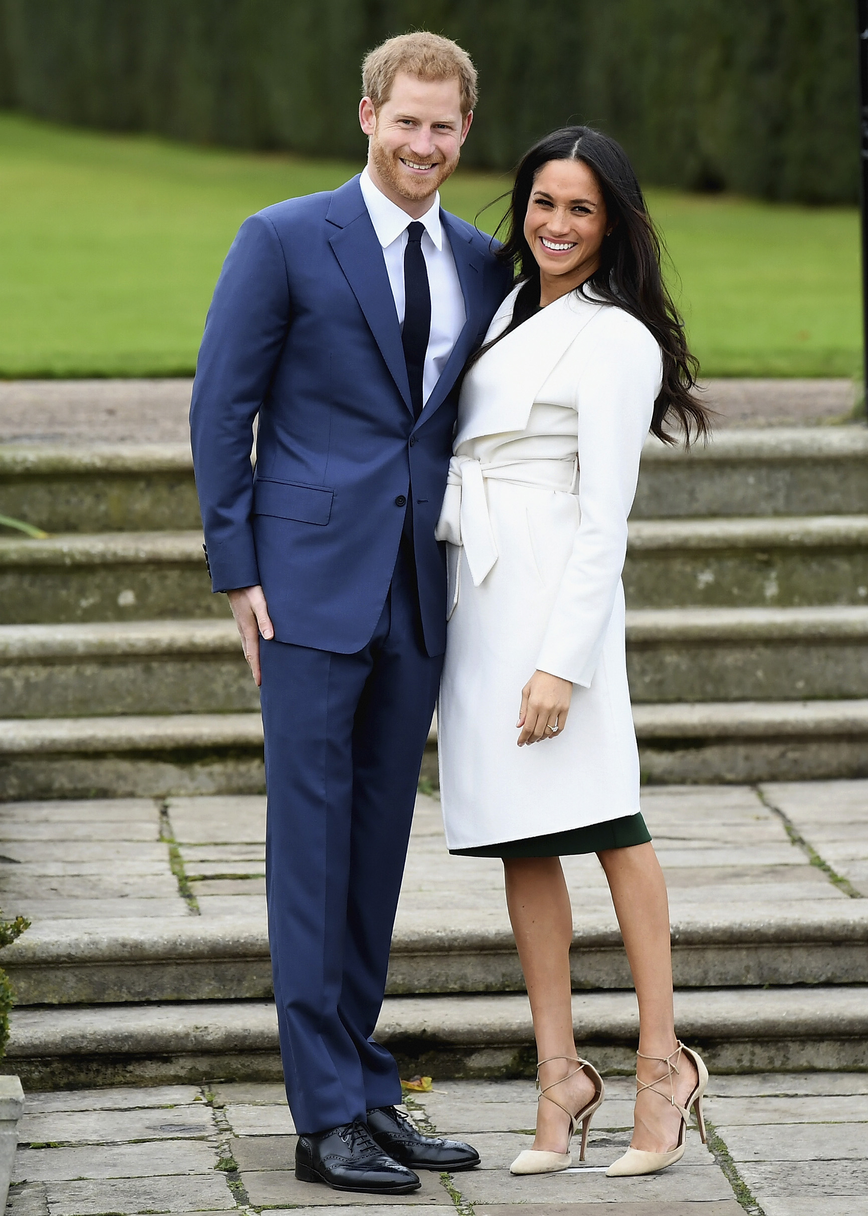 LONDON, ENGLAND - NOVEMBER 27: Prince Harry (L) and Meghan Markle during an official photocall to announce the engagement of Prince Harry and actress Meghan Markle at The Sunken Gardens at Kensington Palace on November 27, 2017 in London, England. Prince Harry and Meghan Markle have been a couple officially since November 2016 and are due to marry in Spring 2018. (Photo by Samir Hussein/Samir Hussein/WireImage)