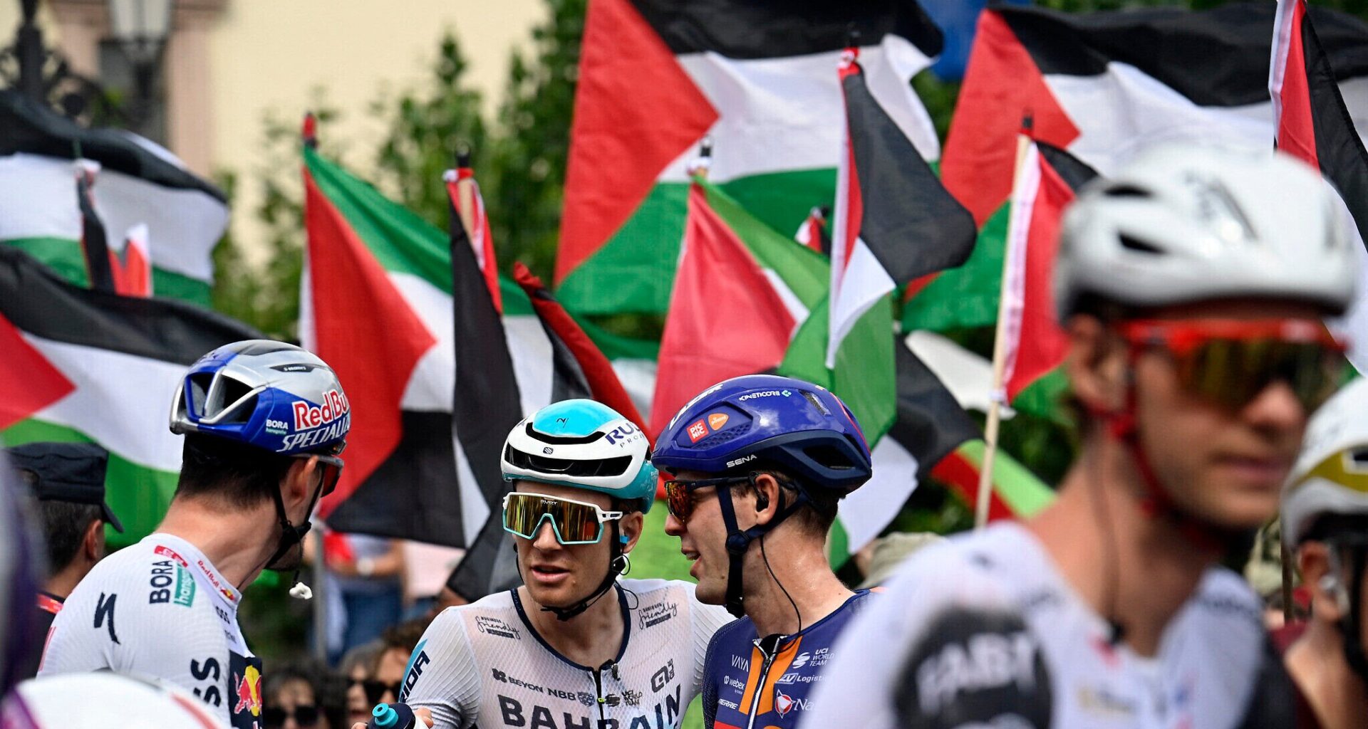 Protester waving Palestinian flag causes crash during major Vuelta cycling race