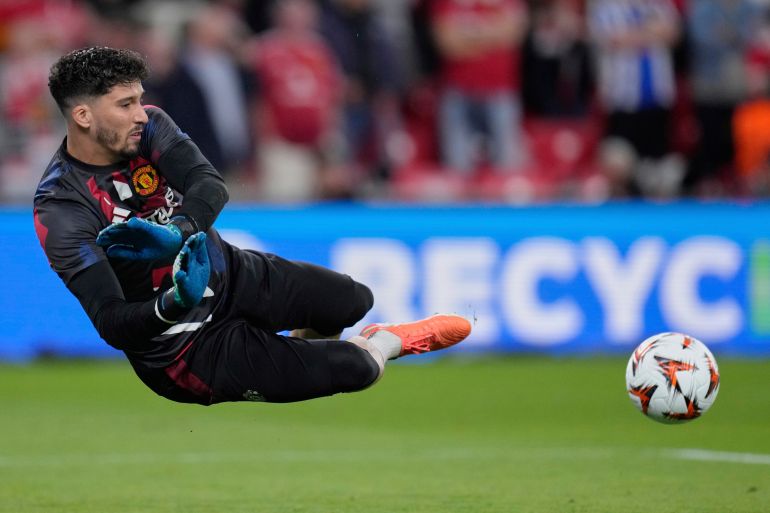 Manchester United's goalkeeper Altay Bayindir warms up