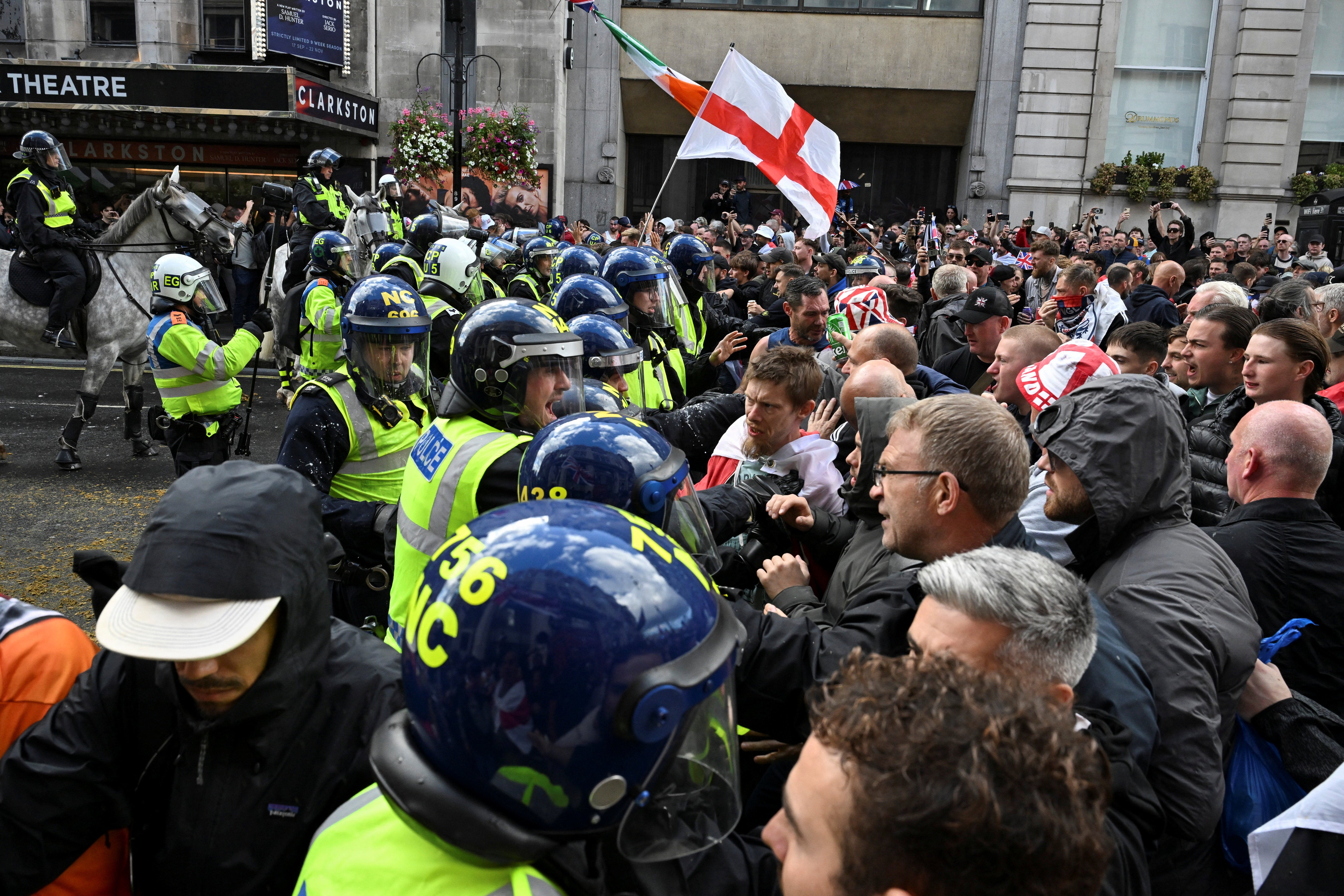 Anti-racism protesters gather to counter an anti-immigration rally led by Tommy Robinson, in London