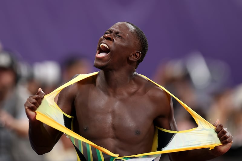 Oblique Seville of Jamaica rips his shirt in celebration after winning the men's 100m final at the World Athletics Championships. Photograph: Emilee Chinn/Getty