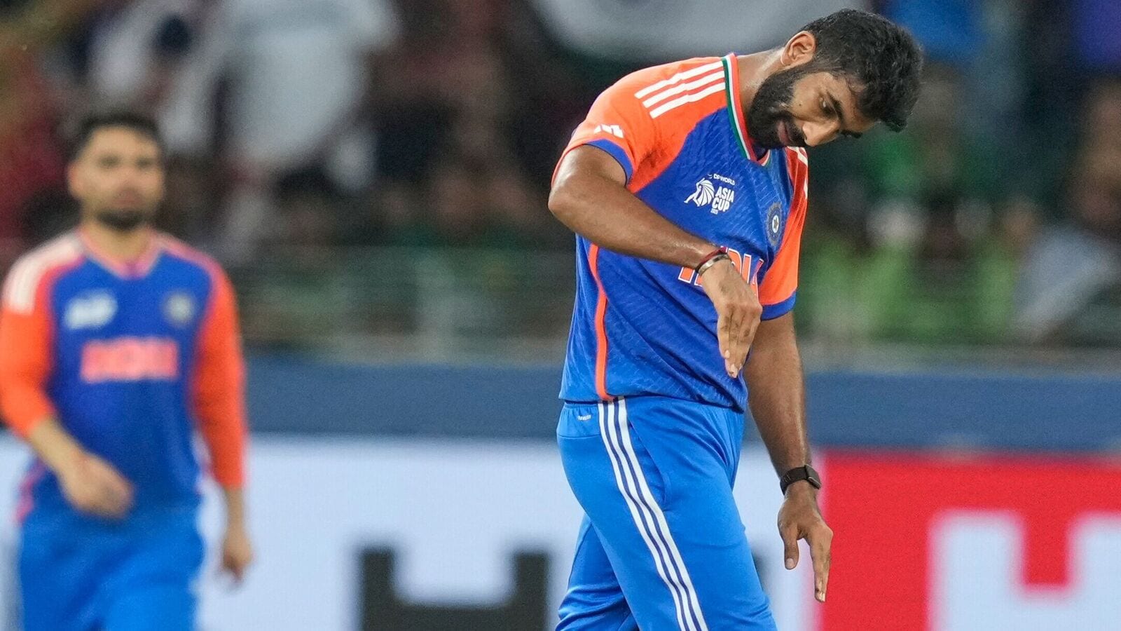 India's Jasprit Bumrah celebrates the wicket of Pakistan's Haris Rauf with a dipping flight celebration.