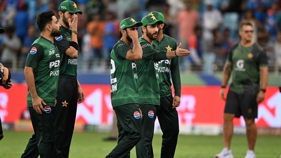 Pakistan's players walk back to the pavilion at the end of the Asia Cup match against India at the Dubai International Stadium(AFP)