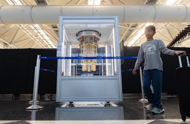 Ishaan Jain, 8, of Bartlett, walks near a model of the inside of a quantum computer, Sept. 25, 2025, at Terminal 1 in Chicago's O'Hare International Airport. The exhibit is organized by members of the STAGE Center at the University of Chicago's Pritzker School of Molecular Engineering and IBM. (Dominic Di Palermo/Chicago Tribune)