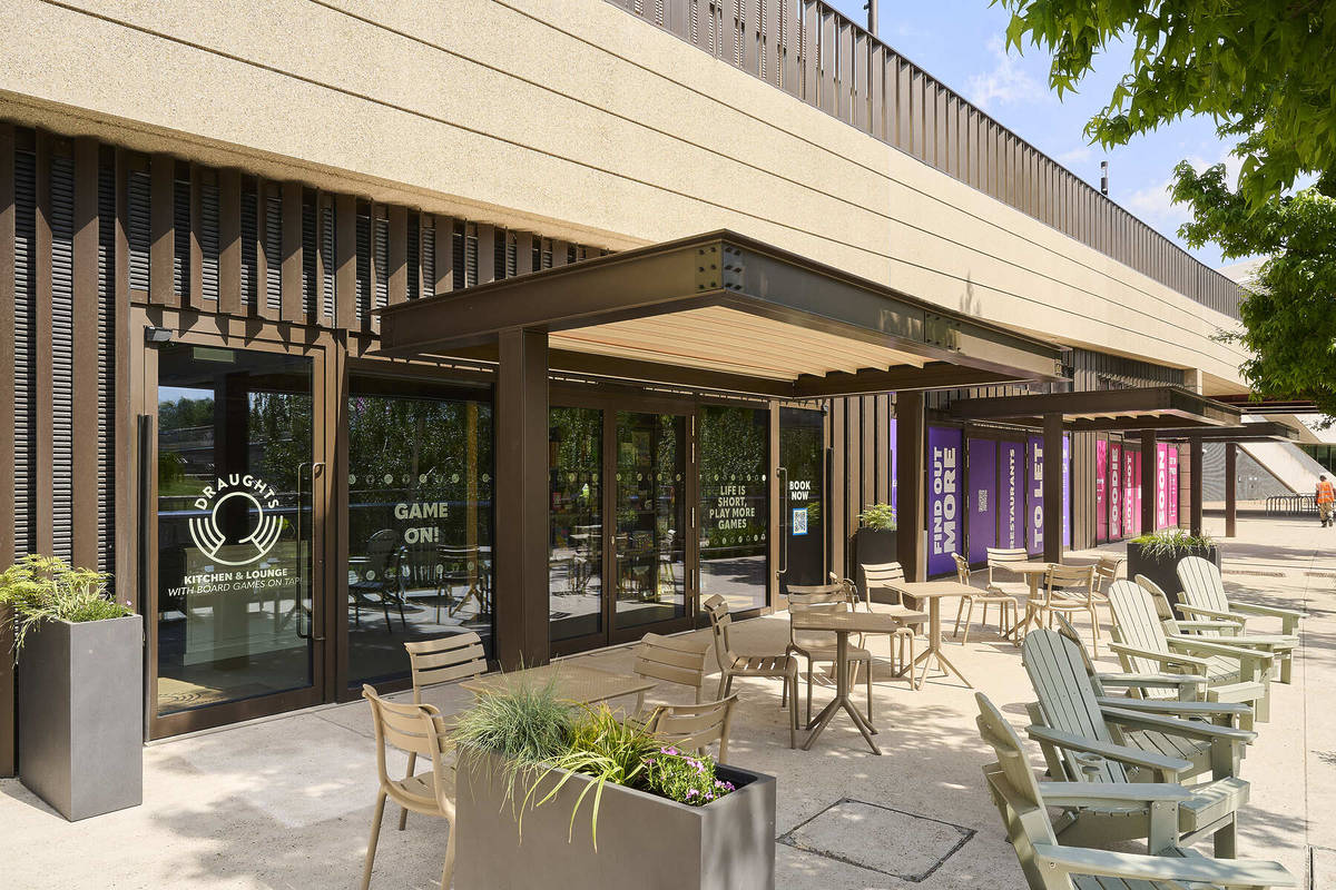 the outdoor area at draughts stratford with a selection of tables and chairs arranged around the space