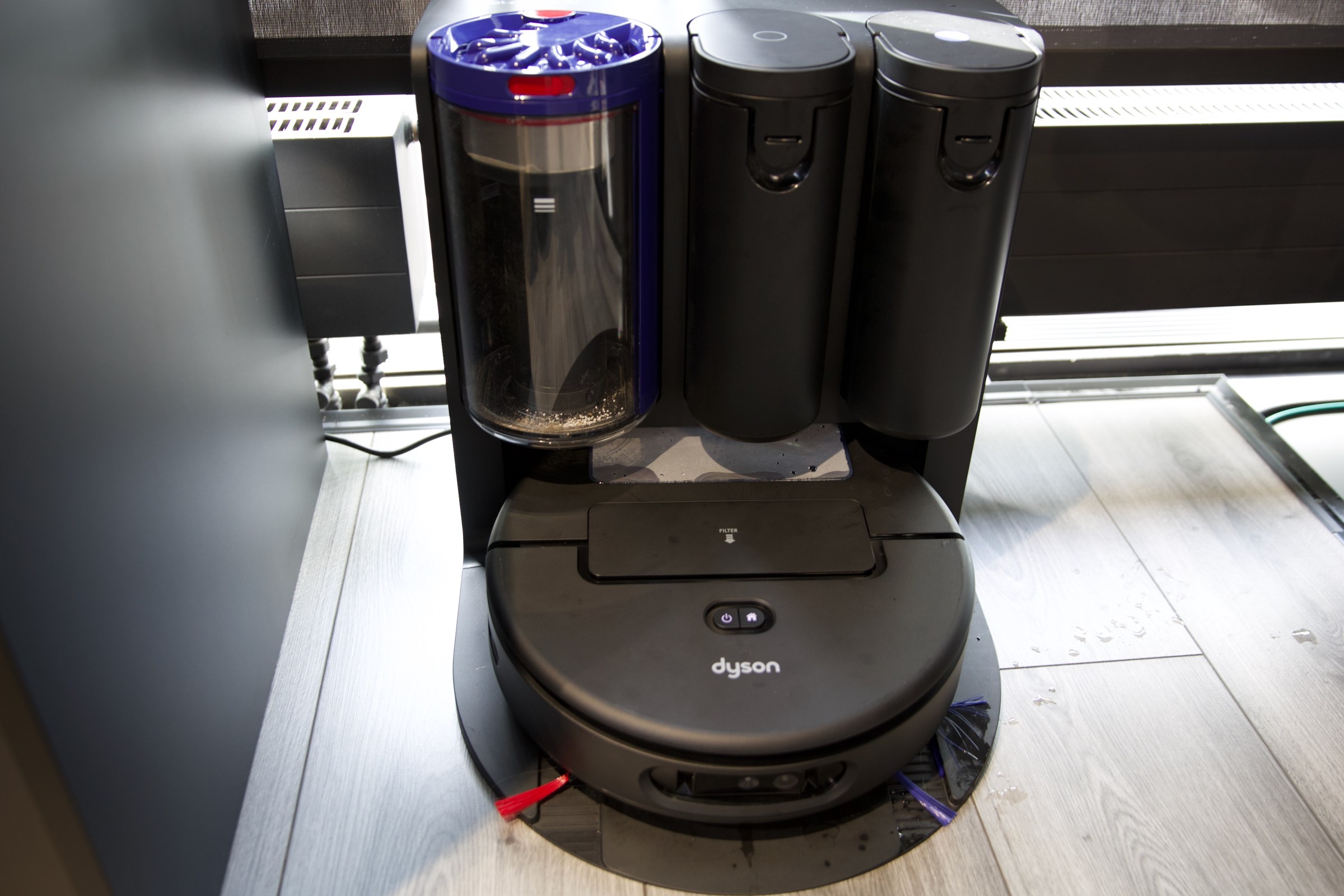 The Dyson Spot+Scrub Ai Robot, sitting in its combination docking station.